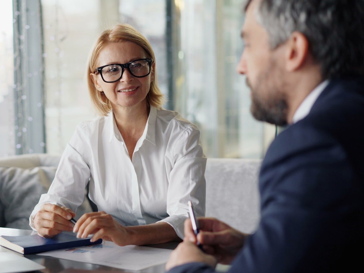 An adviser talking a client through the options on their file
