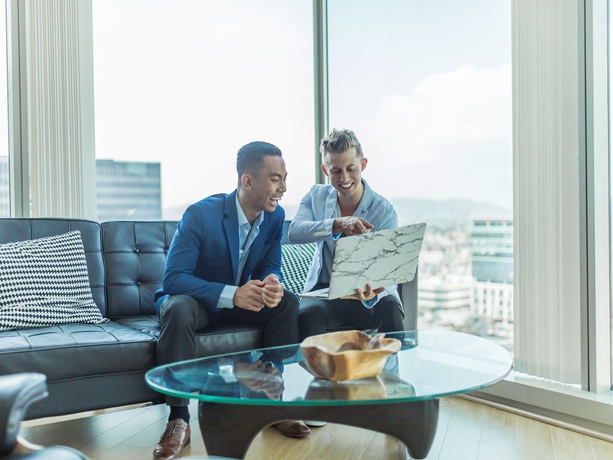 Two professionals in consultation overlooking the city
