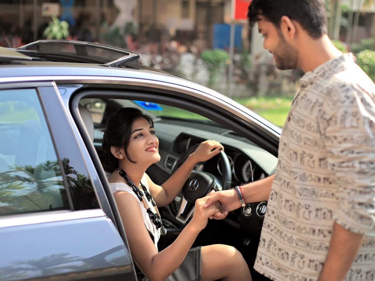 A buyer being handed the keys to her new car