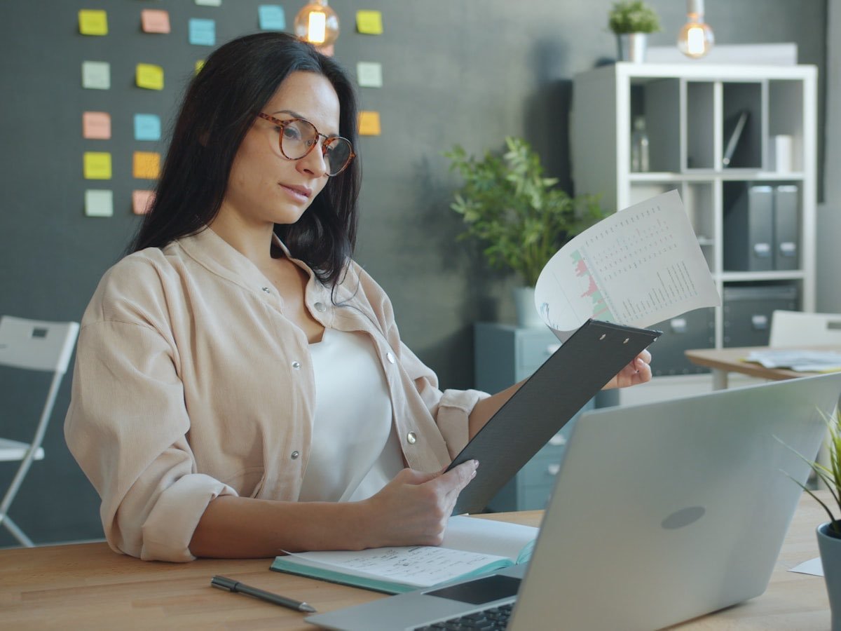 An adviser going through the figures in a loan file