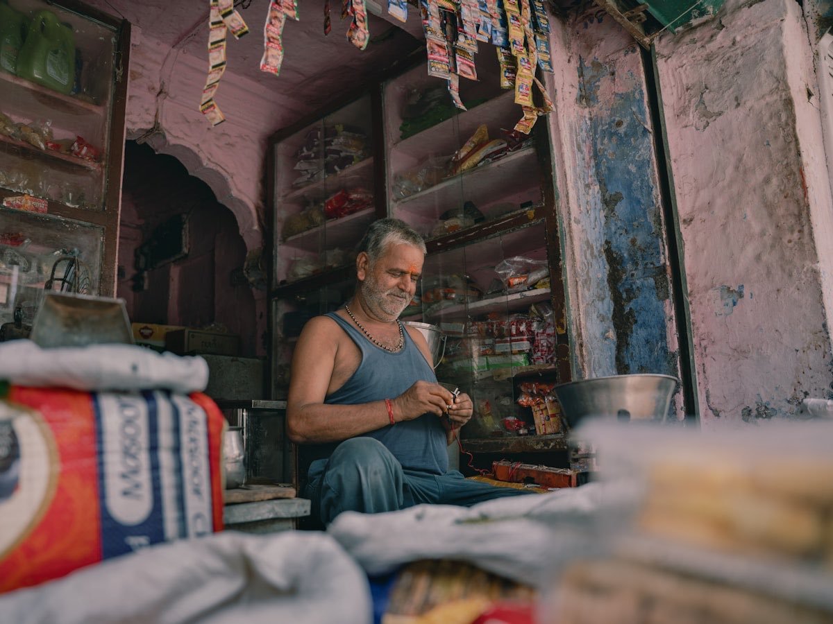 A tailor at work in his own micro-enterprise