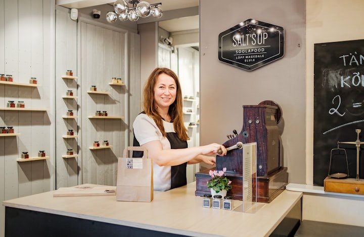 The owner of a new small business at her counter